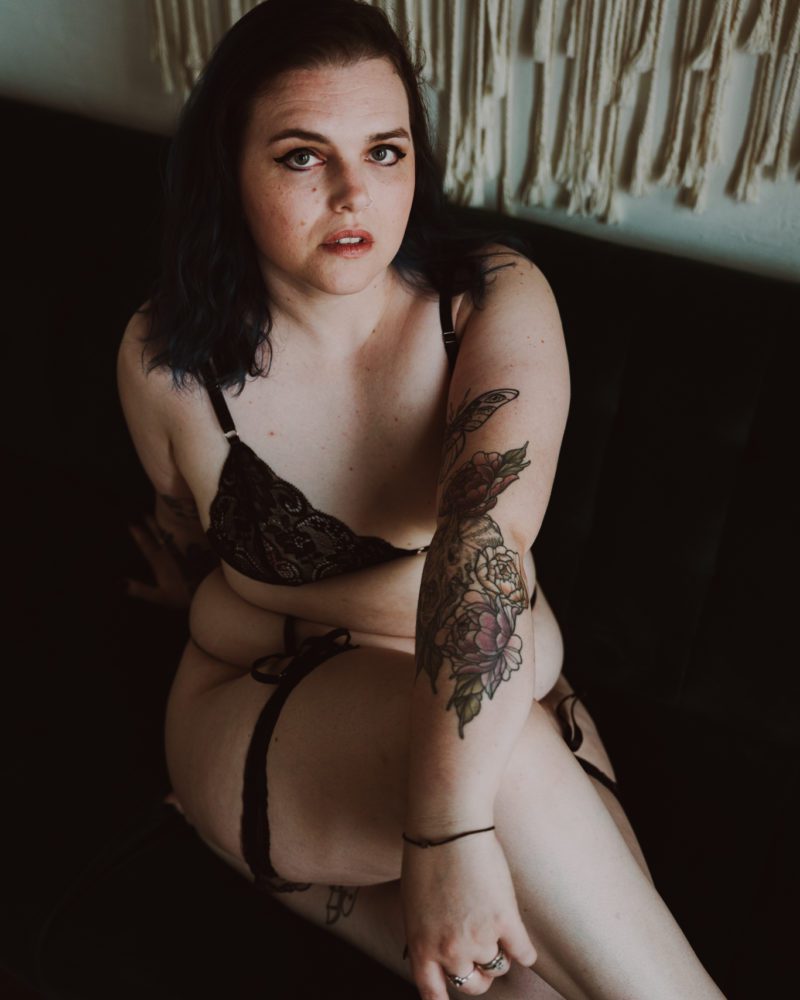 inclusive boudoir photographer captures stunning images of a woman during her empowering boudoir photoshoot