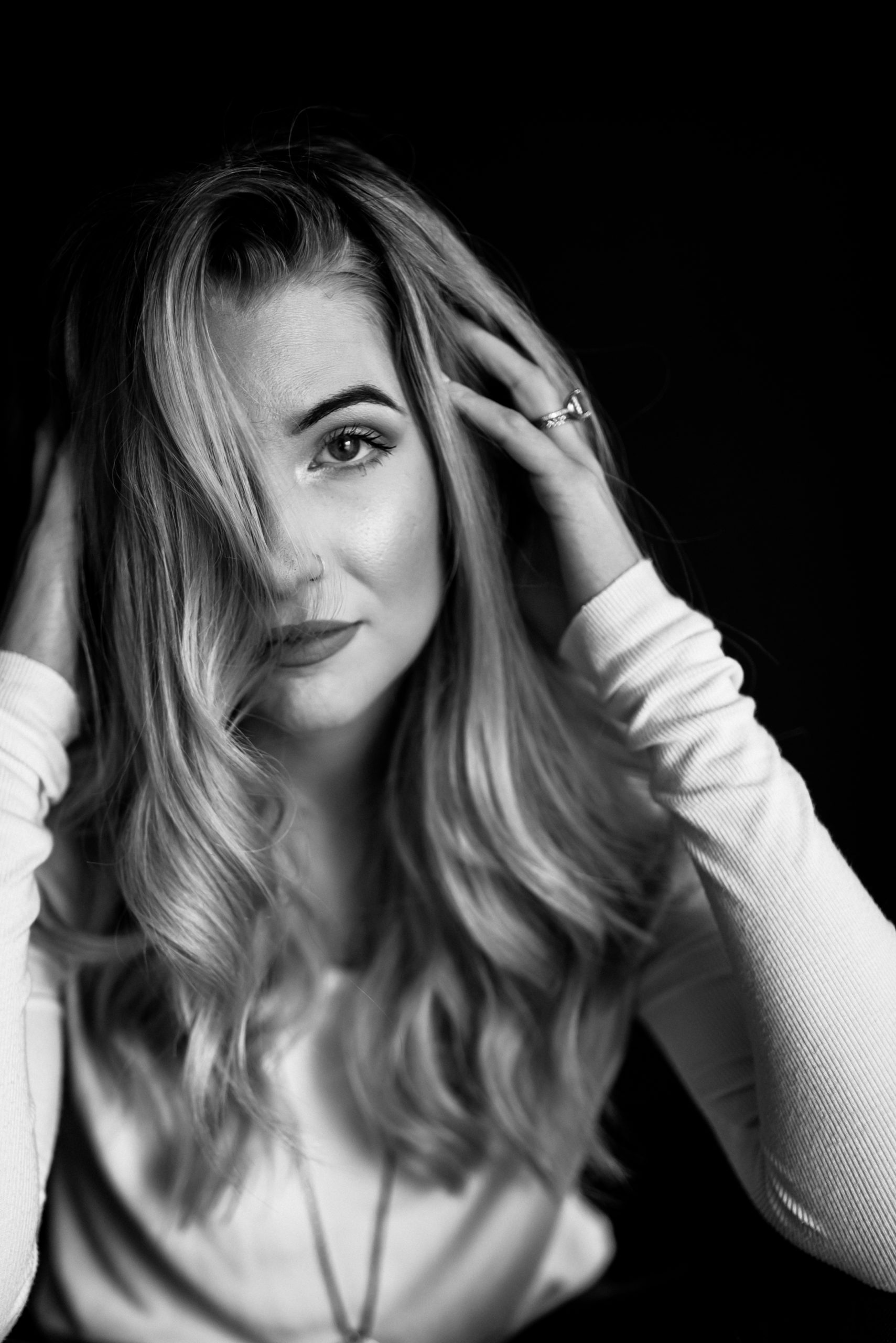 sexy black and white headshot of a woman staring directly into the camera of her Sacramento photographer